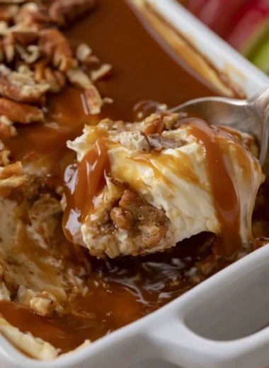 Caramel Apple Cheesecake Dip served with apple slices and caramel drizzle