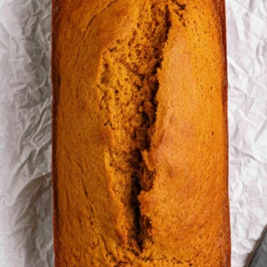 Cozy cake mix pumpkin bread topped with spices and pumpkin seeds
