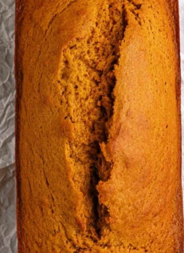 Cozy cake mix pumpkin bread topped with spices and pumpkin seeds