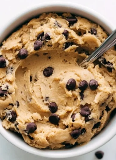 Cozy edible cookie dough in a bowl with chocolate chips