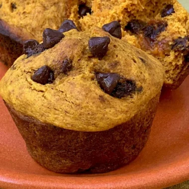 Cozy Greek Yogurt Pumpkin Muffins fresh out of the oven with spices and texture