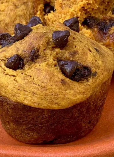 Cozy Greek Yogurt Pumpkin Muffins fresh out of the oven with spices and texture