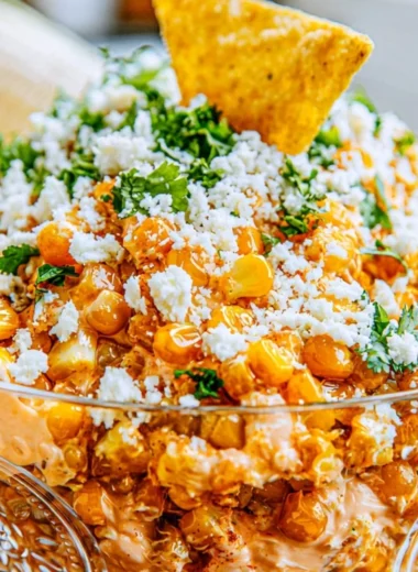 Creamy and flavorful Mexican Street Corn Dip served in a bowl with toppings.