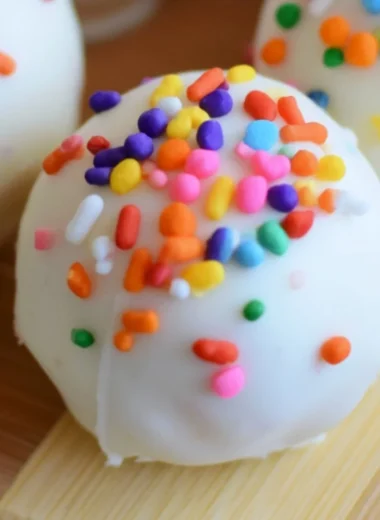 Cozy no-bake cake batter truffles topped with colorful sprinkles