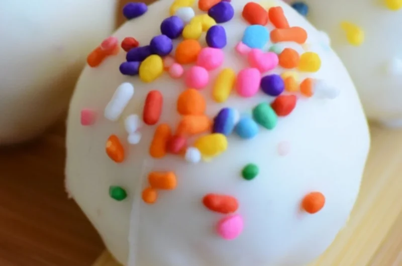 Cozy no-bake cake batter truffles topped with colorful sprinkles