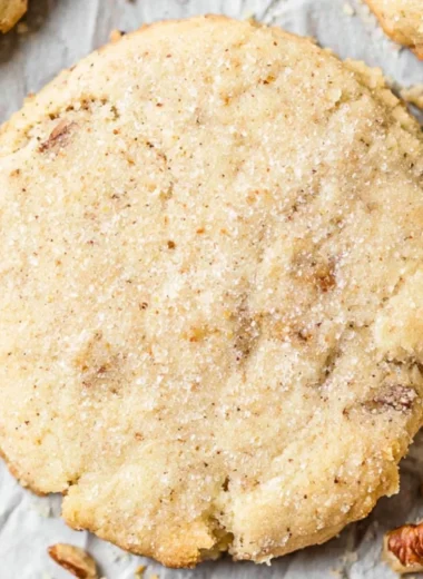 Cozy homemade Pecan Sandies cookies arranged on a plate.