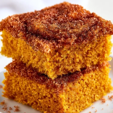 Cozy pumpkin snickerdoodle snack cake topped with cinnamon sugar