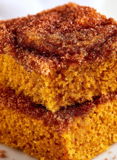 Cozy pumpkin snickerdoodle snack cake topped with cinnamon sugar