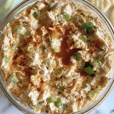 Bowl of creamy Buffalo Chicken Salad with vibrant vegetables and sauce