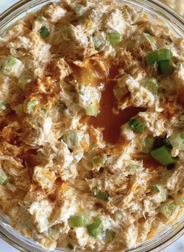 Bowl of creamy Buffalo Chicken Salad with vibrant vegetables and sauce