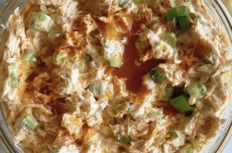 Bowl of creamy Buffalo Chicken Salad with vibrant vegetables and sauce