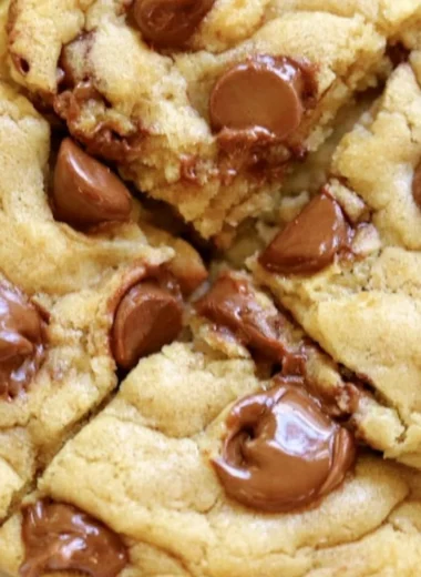 Freshly baked Crumbl chocolate chip cookies with gooey chocolate chunks