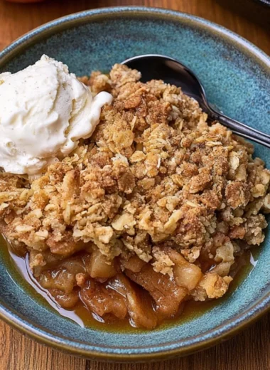 Delicious cast iron apple crisp dessert topped with oats and cinnamon