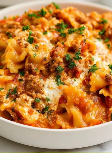 Instant Pot Lazy Lasagna served in a bowl with melted cheese and herbs