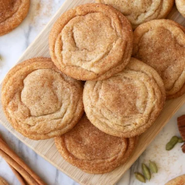 Freshly baked Chai Snickerdoodles cookies on a rustic wooden table