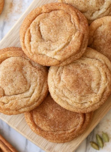 Freshly baked Chai Snickerdoodles cookies on a rustic wooden table