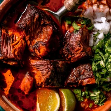 Delicious bowl of authentic Mexican Birria with herbs and spices.