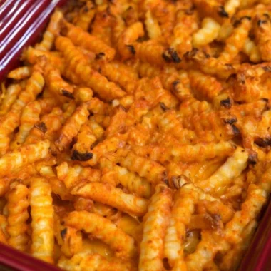Cheeseburger French Fry Casserole topped with melted cheese and crispy fries