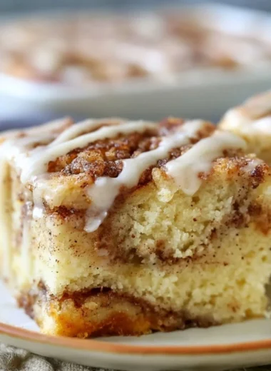 Delicious homemade cozy cinnamon roll cake drizzled with icing