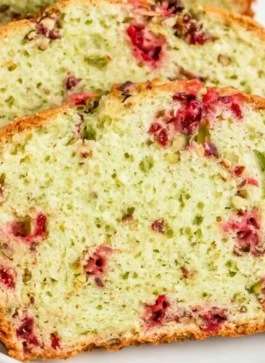 Freshly baked cozy Cranberry Pistachio Bread with nuts and cranberries