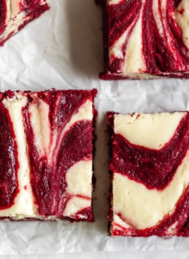 Delicious red velvet cheesecake brownies on a plate
