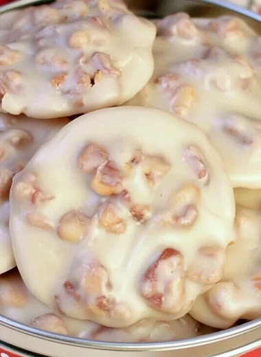 Delicious homemade vanilla pecan pralines on wooden table