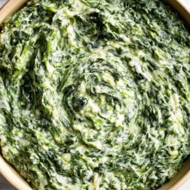 Delicious creamy creamed spinach served in a bowl as a comforting side dish.