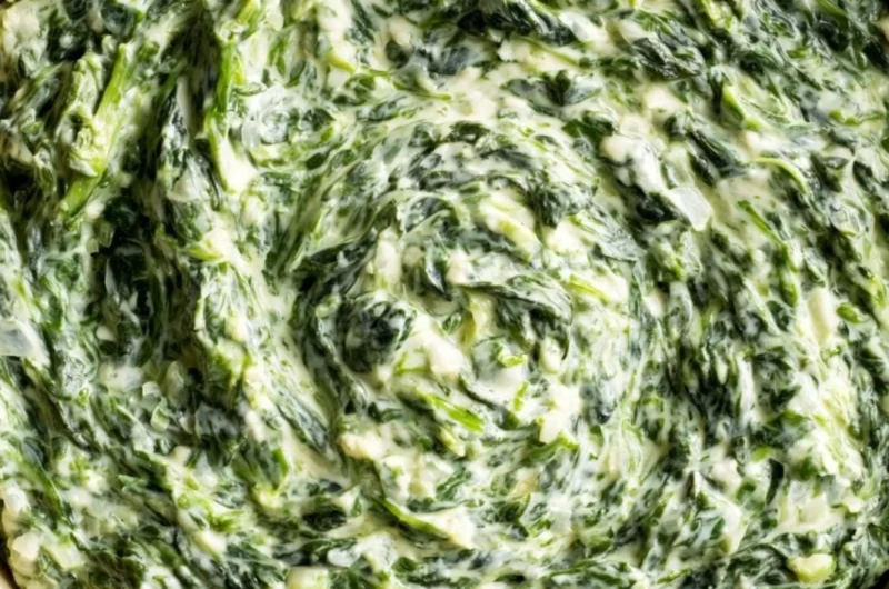 Delicious creamy creamed spinach served in a bowl as a comforting side dish.