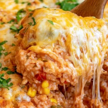 One pot cheesy enchilada rice topped with melted cheese and fresh cilantro