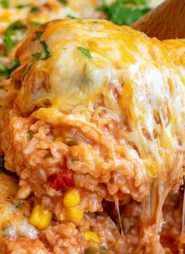 One pot cheesy enchilada rice topped with melted cheese and fresh cilantro