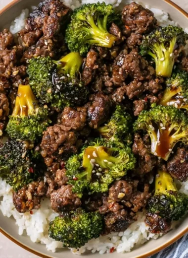 Cozy ground beef and broccoli stir-fry served in a bowl with chopsticks.