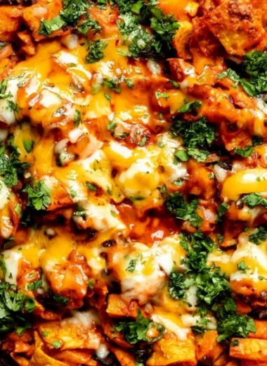 Butternut squash and black bean enchilada skillet topped with cheese