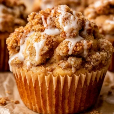 Delicious homemade apple crumble muffins topped with a crunchy crumble