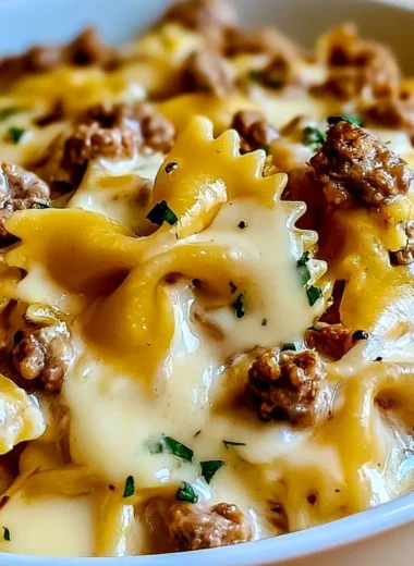Cozy beef and bowtie pasta dish with creamy Alfredo sauce