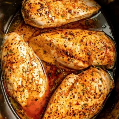 Slow cooker chicken breasts cooked to perfection with herbs and spices