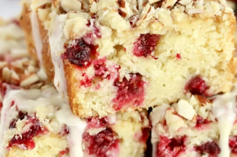 Deliciously moist Cranberry Almond Cake with fresh cranberries and almond slices