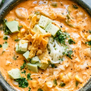 Bowl of award-winning white chicken chili garnished with cilantro and lime.