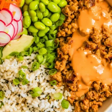 Bang Bang Ground Turkey Rice Bowls served in a colorful bowl with fresh toppings.