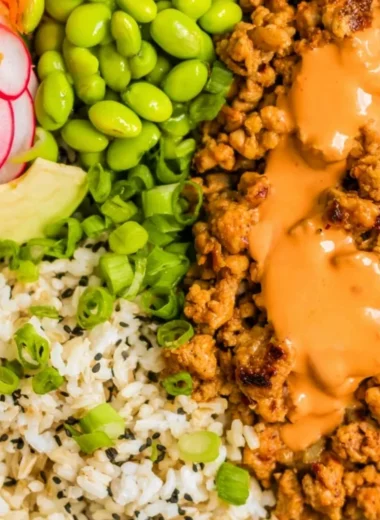 Bang Bang Ground Turkey Rice Bowls served in a colorful bowl with fresh toppings.