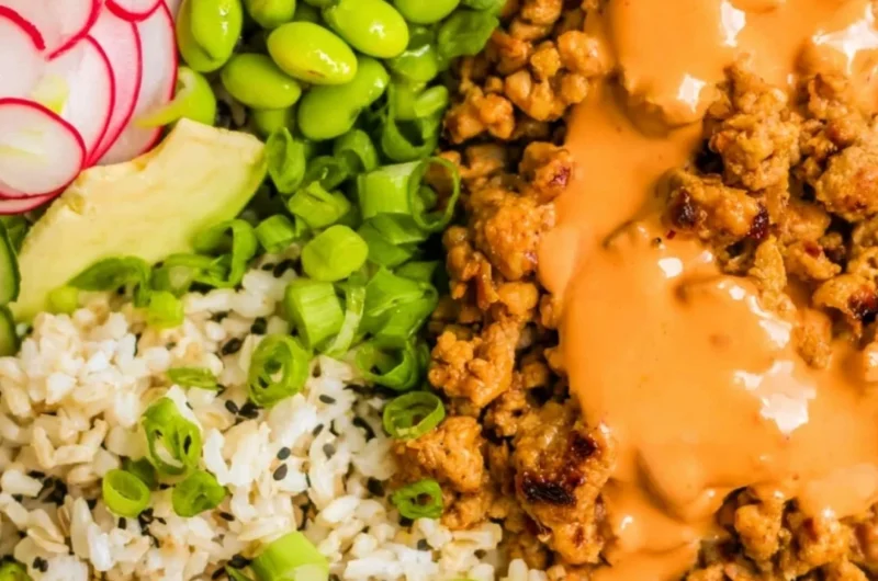 Bang Bang Ground Turkey Rice Bowls served in a colorful bowl with fresh toppings.