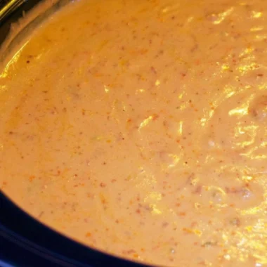 Delicious chorizo cheese dip served in a crockpot with tortilla chips.