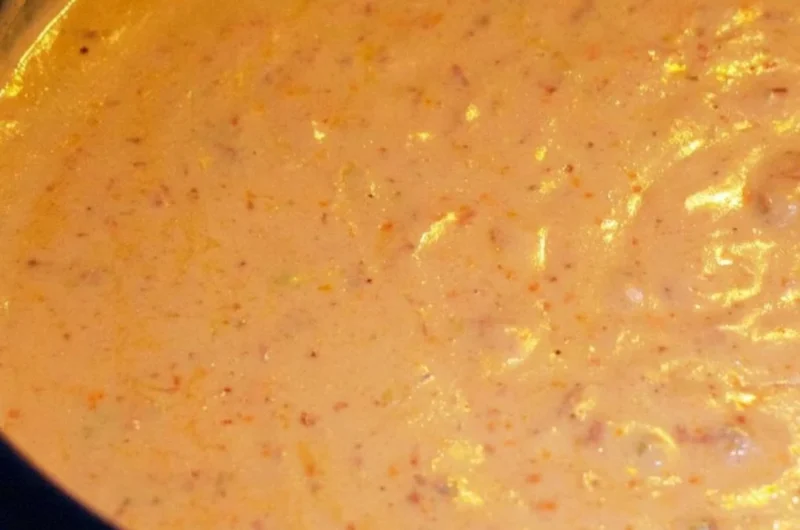 Delicious chorizo cheese dip served in a crockpot with tortilla chips.