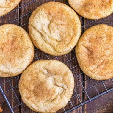 Classic snickerdoodles - soft and chewy cinnamon sugar cookies on a baking sheet.