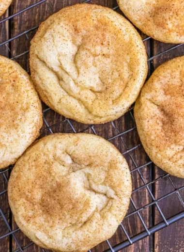 Classic snickerdoodles - soft and chewy cinnamon sugar cookies on a baking sheet.