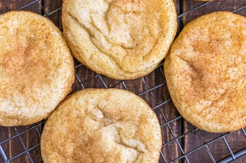 Classic snickerdoodles - soft and chewy cinnamon sugar cookies on a baking sheet.