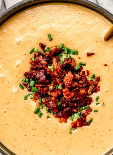 High-protein cream of potato soup served in a white bowl with fresh herbs