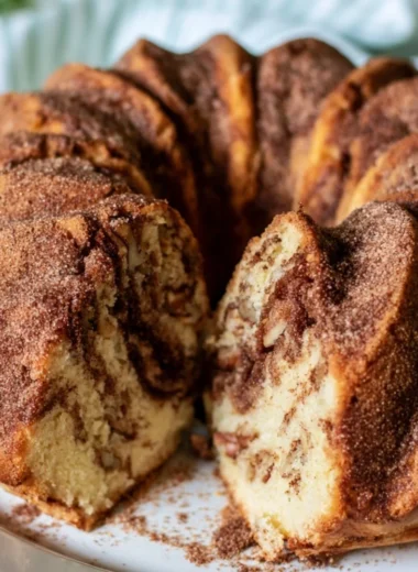 Moist Cinnamon Coffee Cake topped with a cinnamon sugar swirl