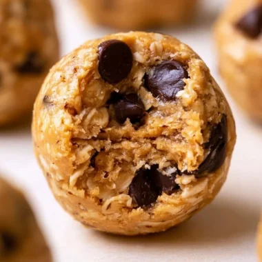 Peanut butter oatmeal protein balls arranged on a plate, a healthy no-bake snack.