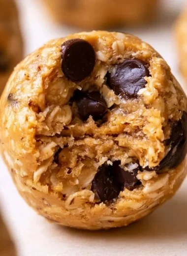 Peanut butter oatmeal protein balls arranged on a plate, a healthy no-bake snack.